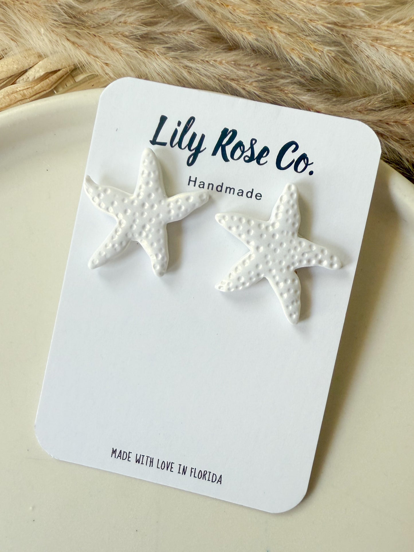 white Shimmer Starfish studs